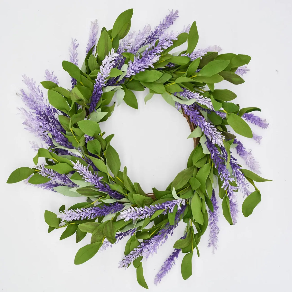 Spring wreath with green foliage and white flowers